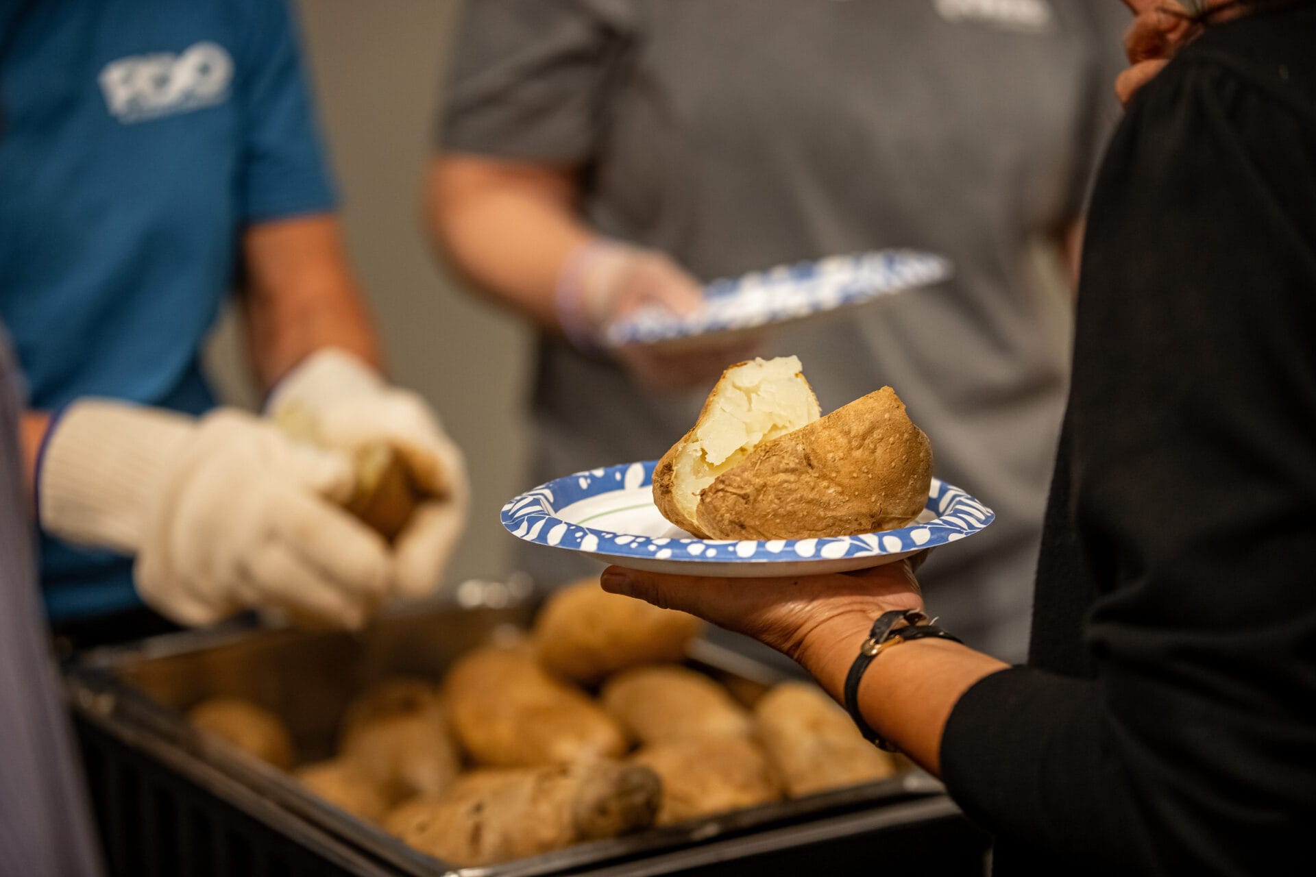 customer getting served at caters taters luncheon